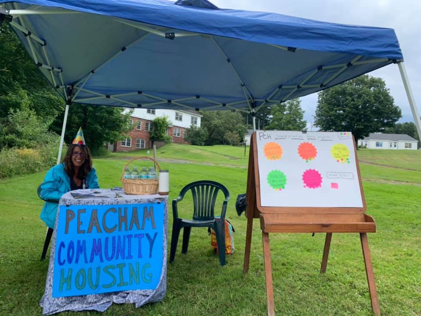 PCH community engagement event with sign and easel